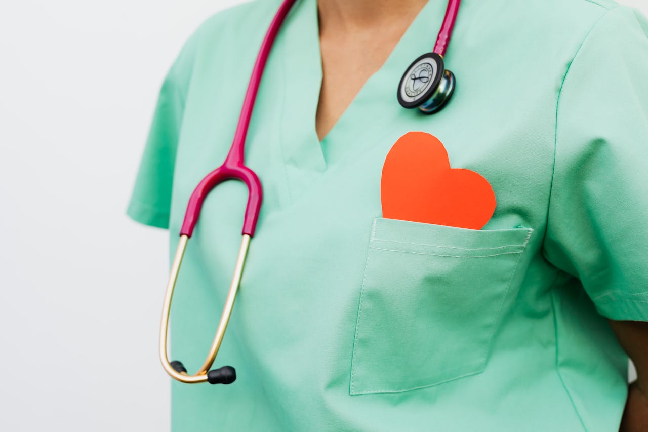 A healthcare professional with a stethoscope and red heart symbol emphasizes cardiology care.